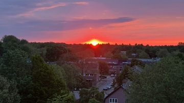 Zonsondergang gezien vanaf flat 70 in Zeist